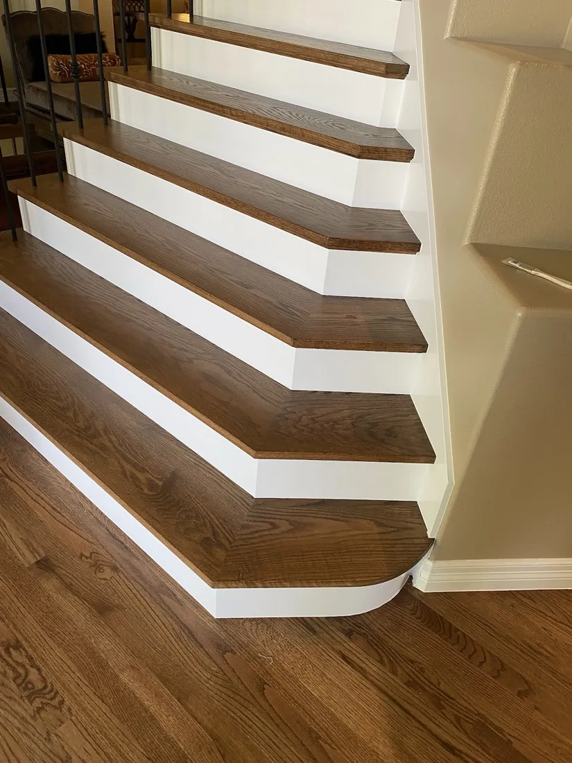 Walnut stair treads against white risers